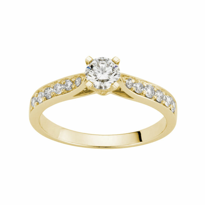 Solitaire accompagne 4 griffes 0.10Ct au centre et 0.216Ct au total  en Or 750 / 1000 (18K)